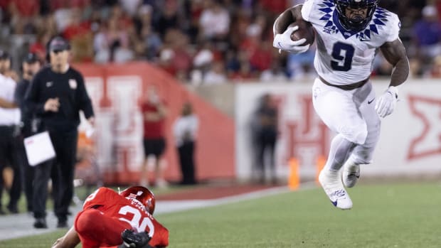 TCU Horned Frogs running back Emani Bailey (9) is tripped by Houston Cougars linebacker Treylin Payne (29) in the second half at TDECU